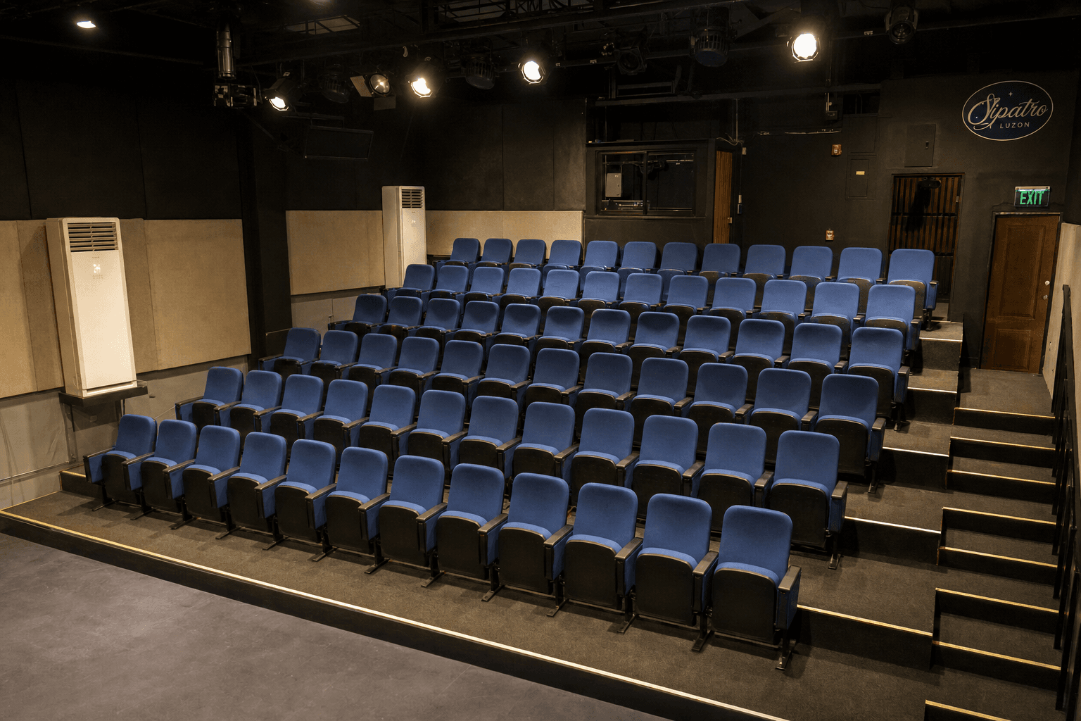 Two theater seats with flip-up armrests and cup holder attached